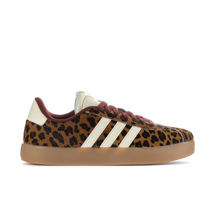 Leopard print low-top sneakers with cream adidas stripes, burgundy laces, gum sole