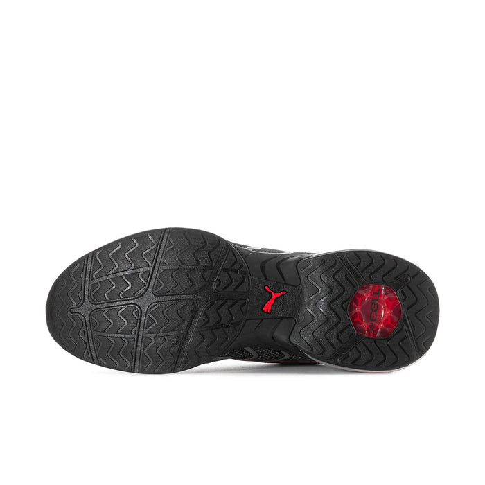 Men's Voltra outsole with textured black tread, red circular insert, and heel traction