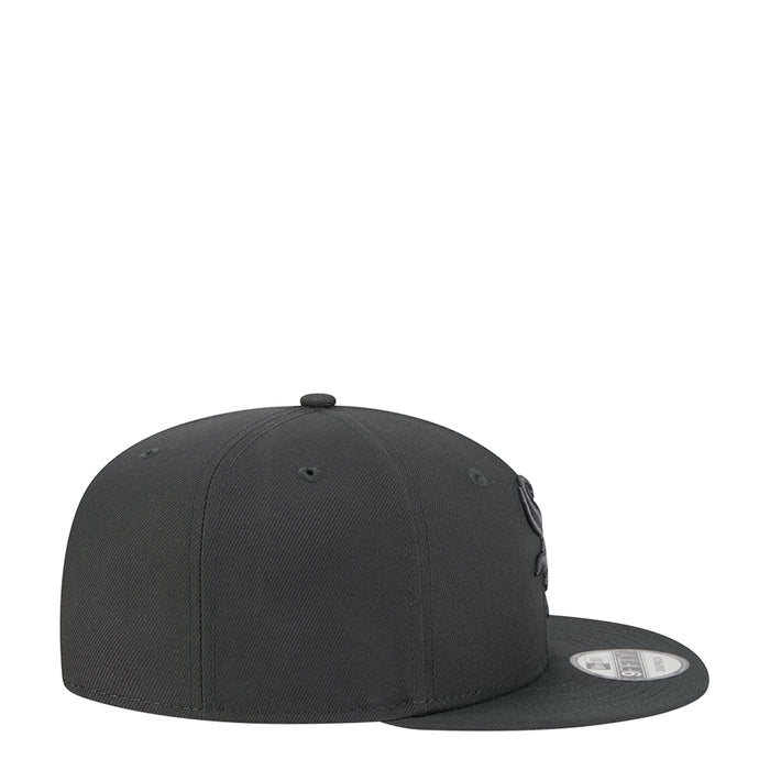 Dark gray baseball cap, side view with curved brim and small logo patch.