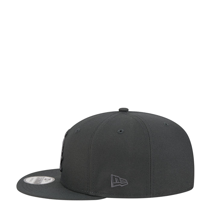 Dark gray baseball cap with New Era flag emblem on front panel.