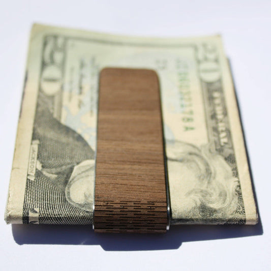 WUDN Handcrafted wooden money clip with smooth finish, designed to securely hold cash and cards in a sleek, natural wood style.